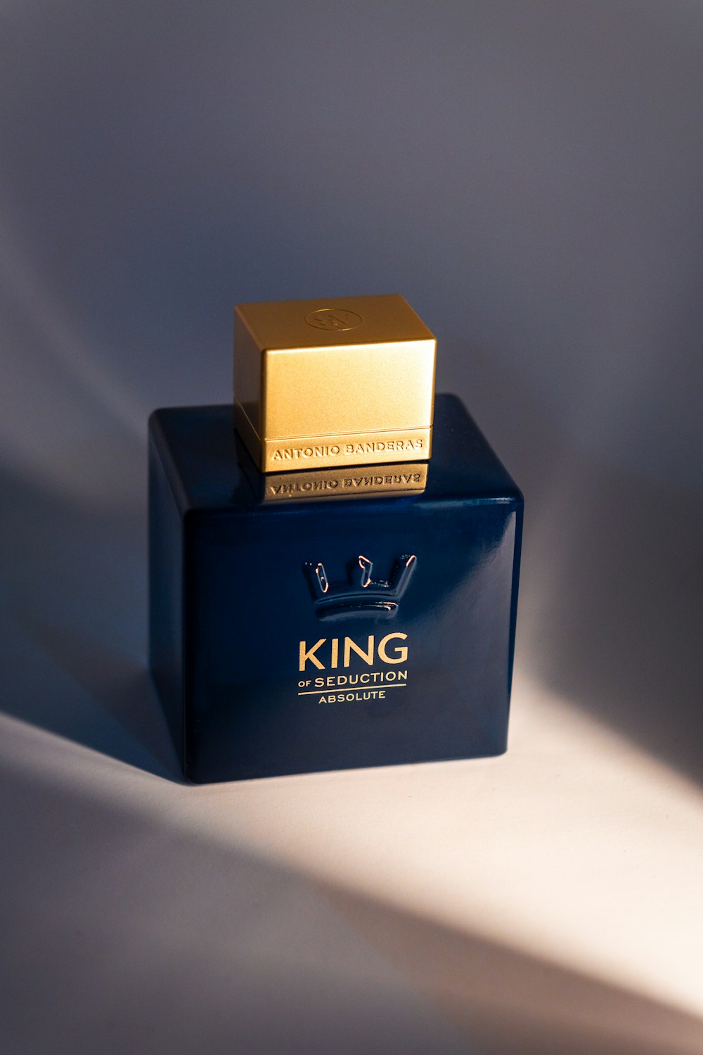 a blue box with a gold square on top of it
