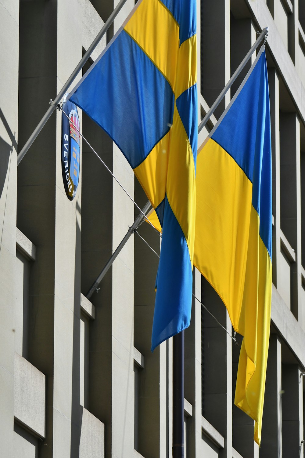 a couple of flags that are on a pole