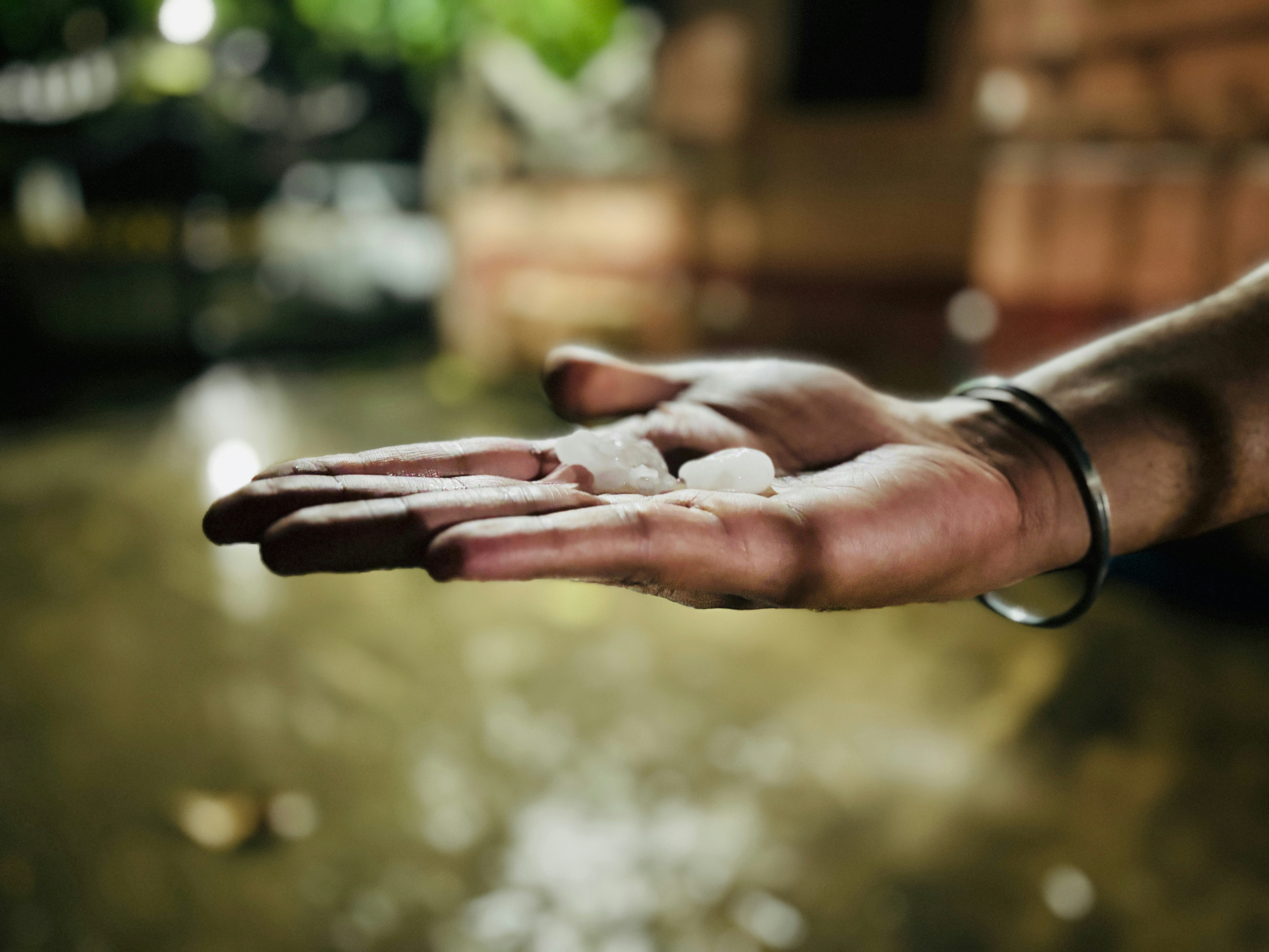 A close-up shot of a hand gently scooping up clean, clear river water, symbolizing hope for a revived Ganga.