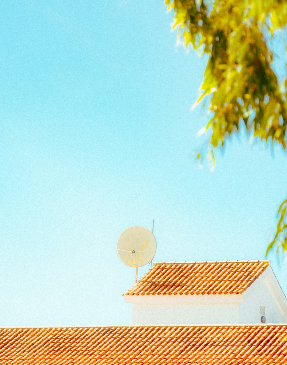 a satellite dish on top of a roof