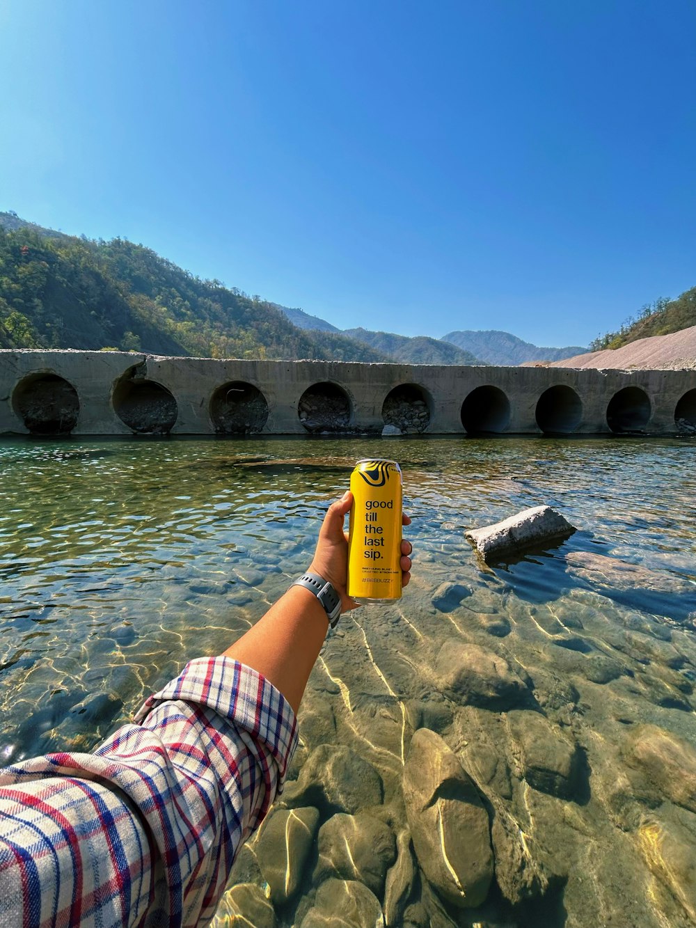 a person holding a yellow object in the water