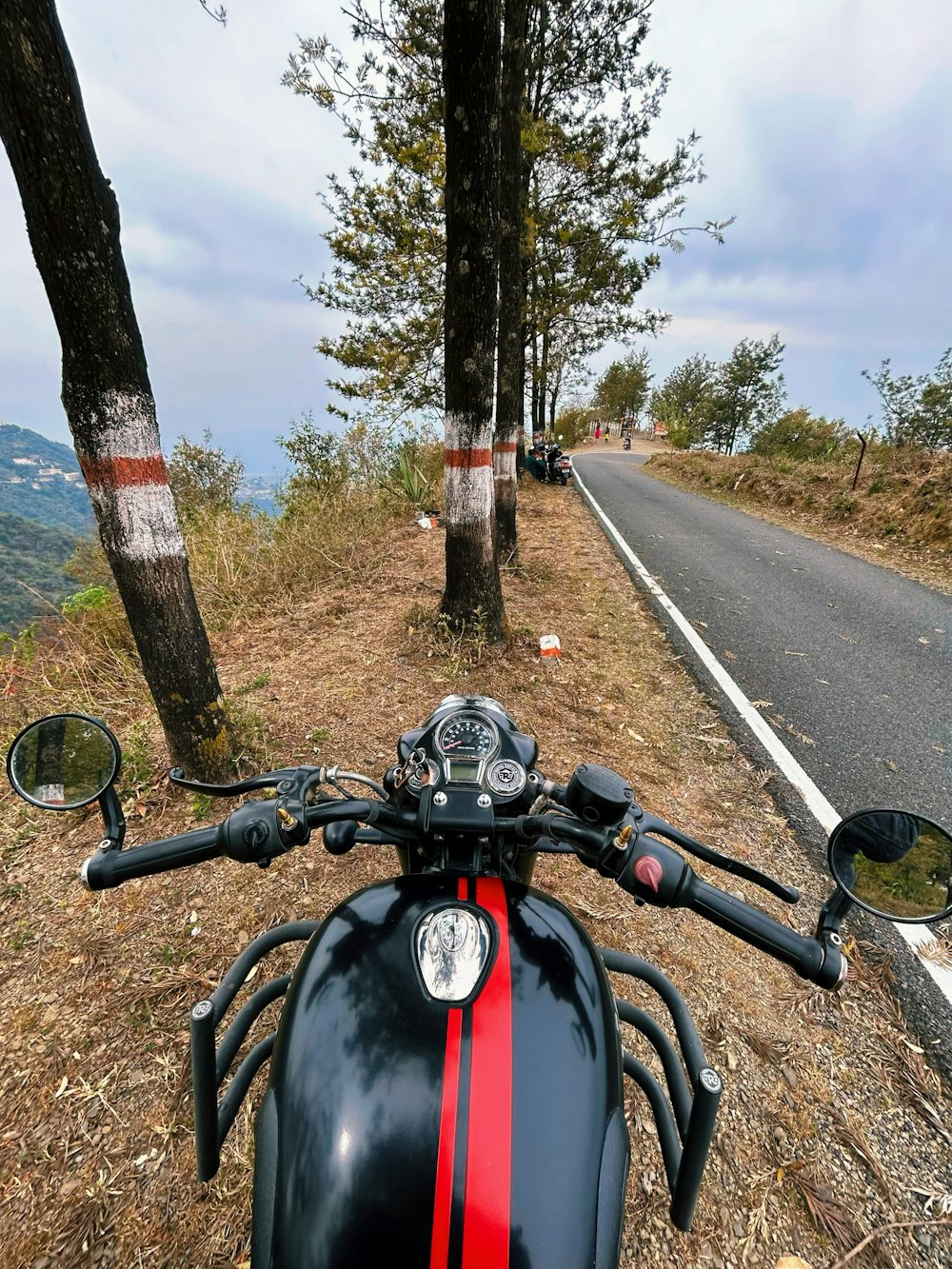 a motorcycle parked on the side of a road