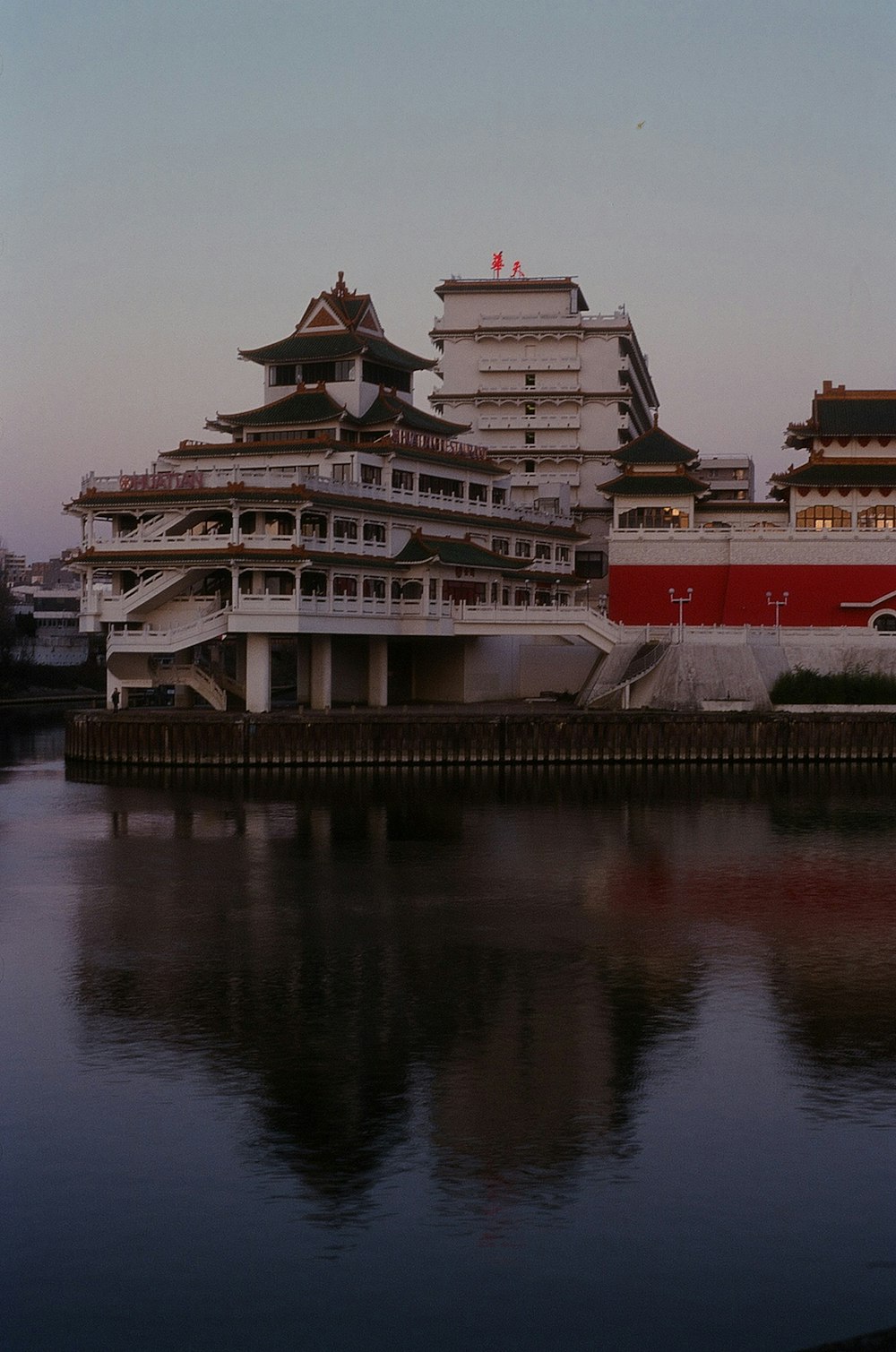 a large body of water with buildings in the background