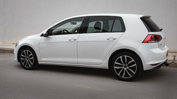 a white car parked on the side of the road