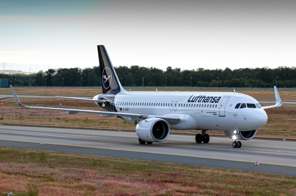 a large jetliner sitting on top of an airport runway