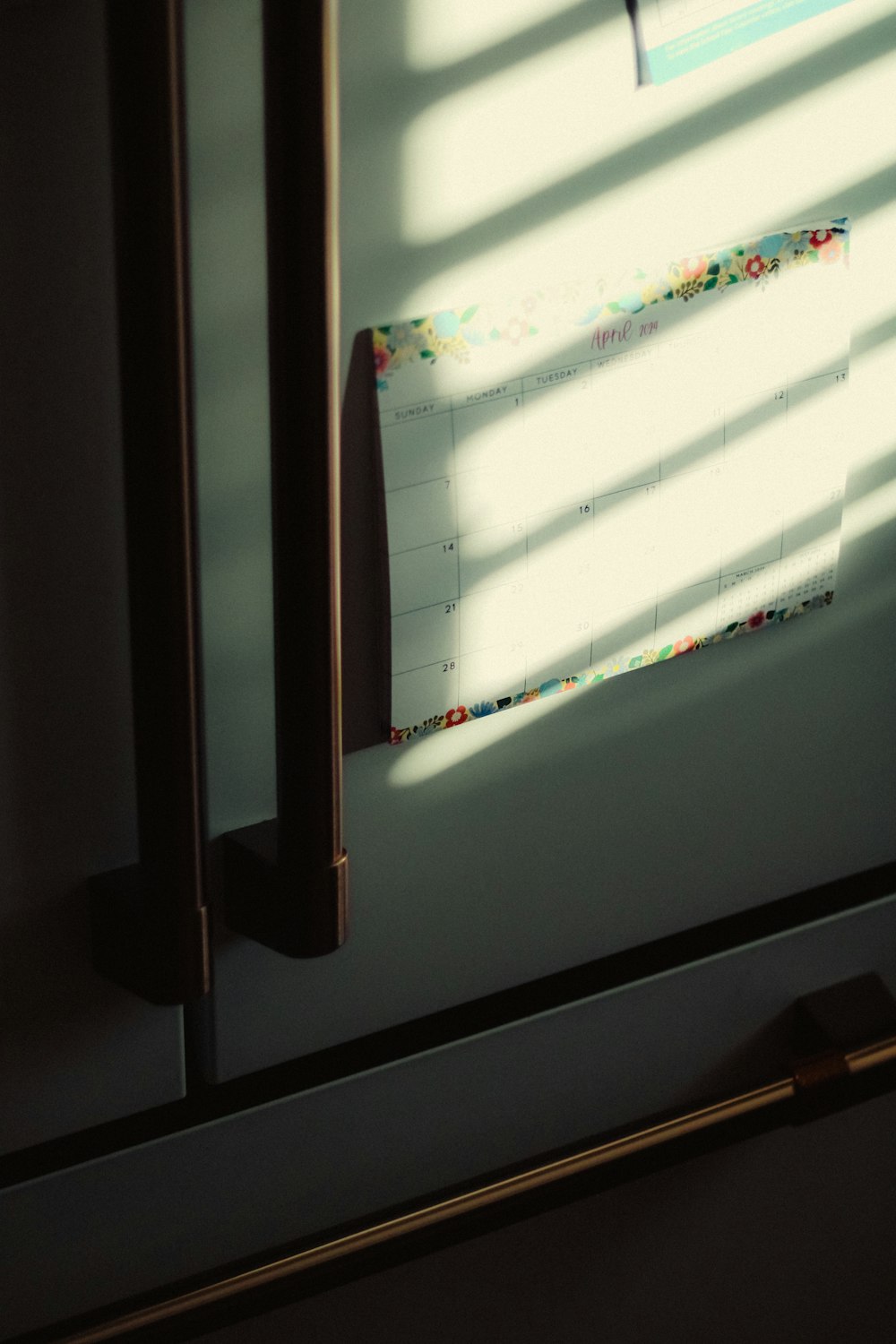 a calendar is hanging on a wall in a room