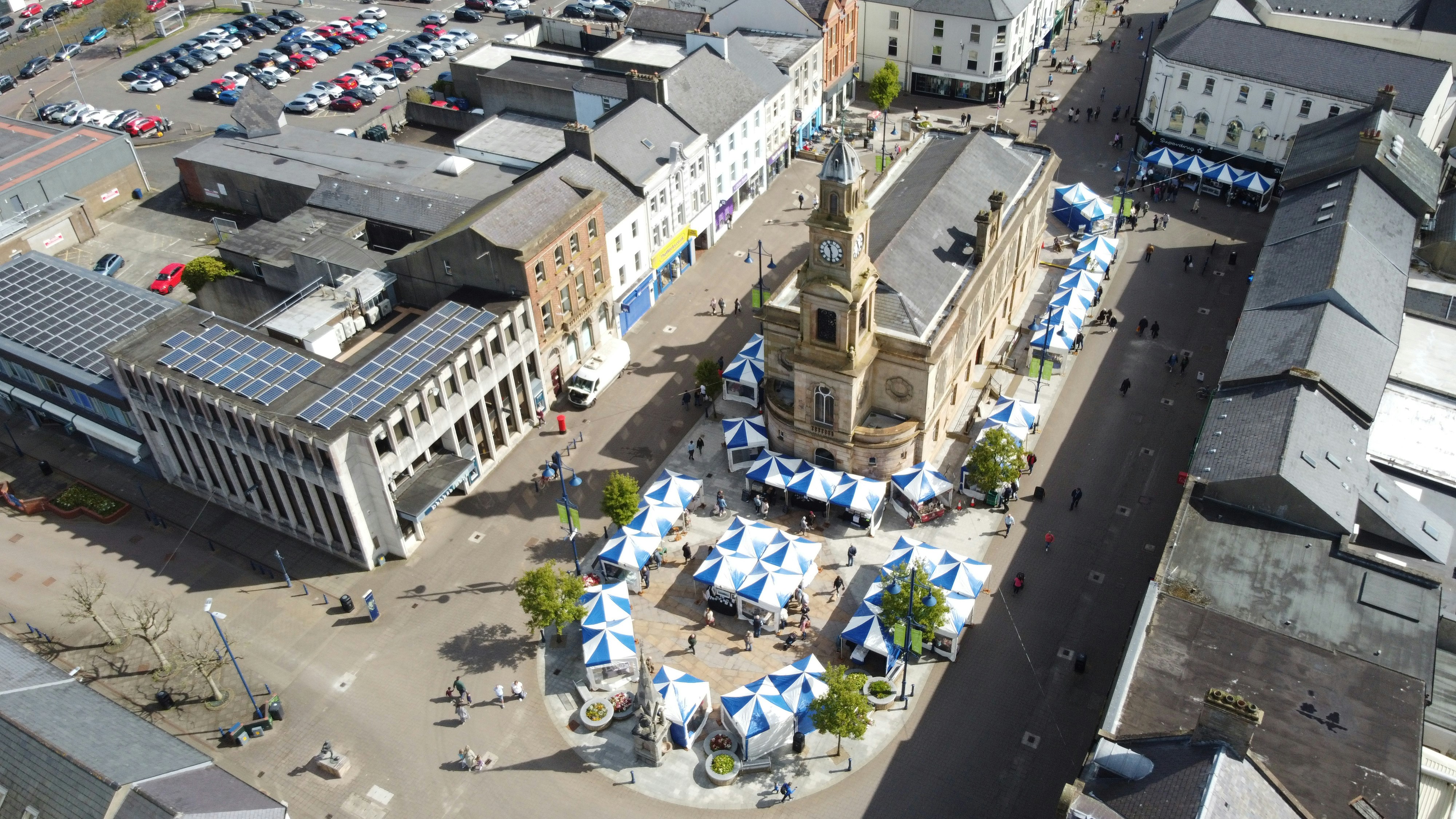 an aerial view of a city with a clock tower