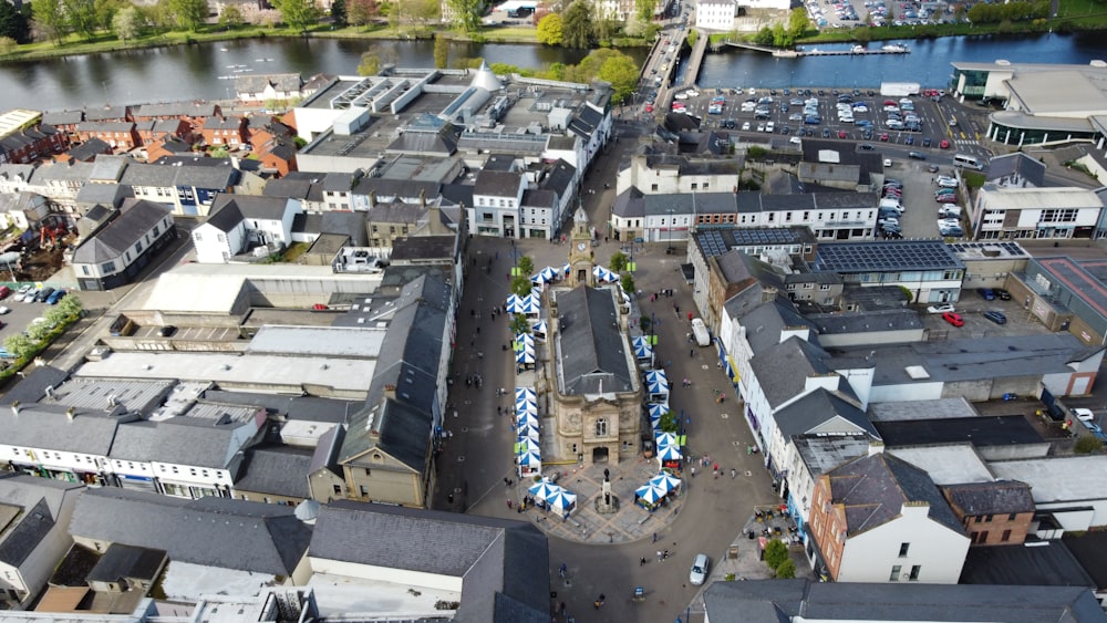 an aerial view of a city with a river in the background