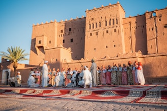 a group of people standing in front of a building