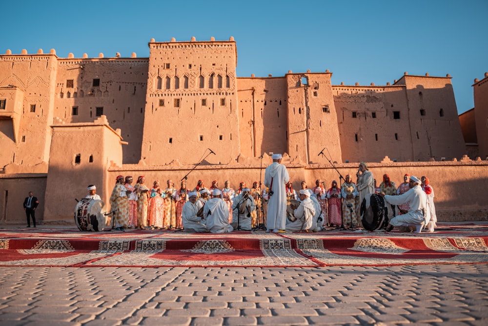 a group of people standing in front of a building