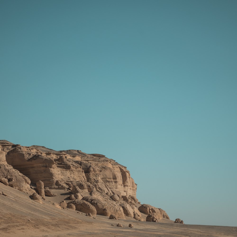 a person riding a horse in the desert