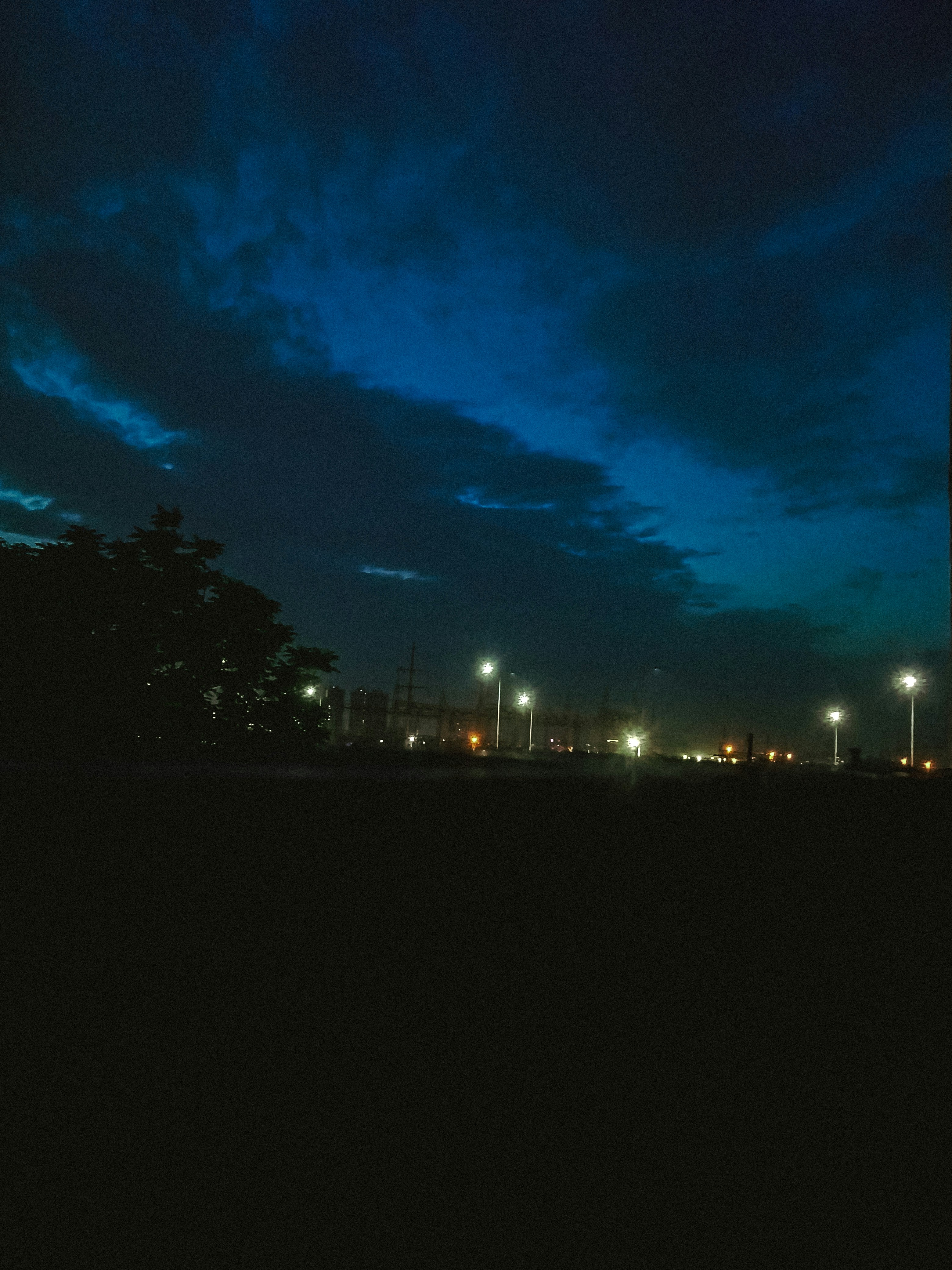 Dark cinematic blue-tinted scene, moody atmosphere