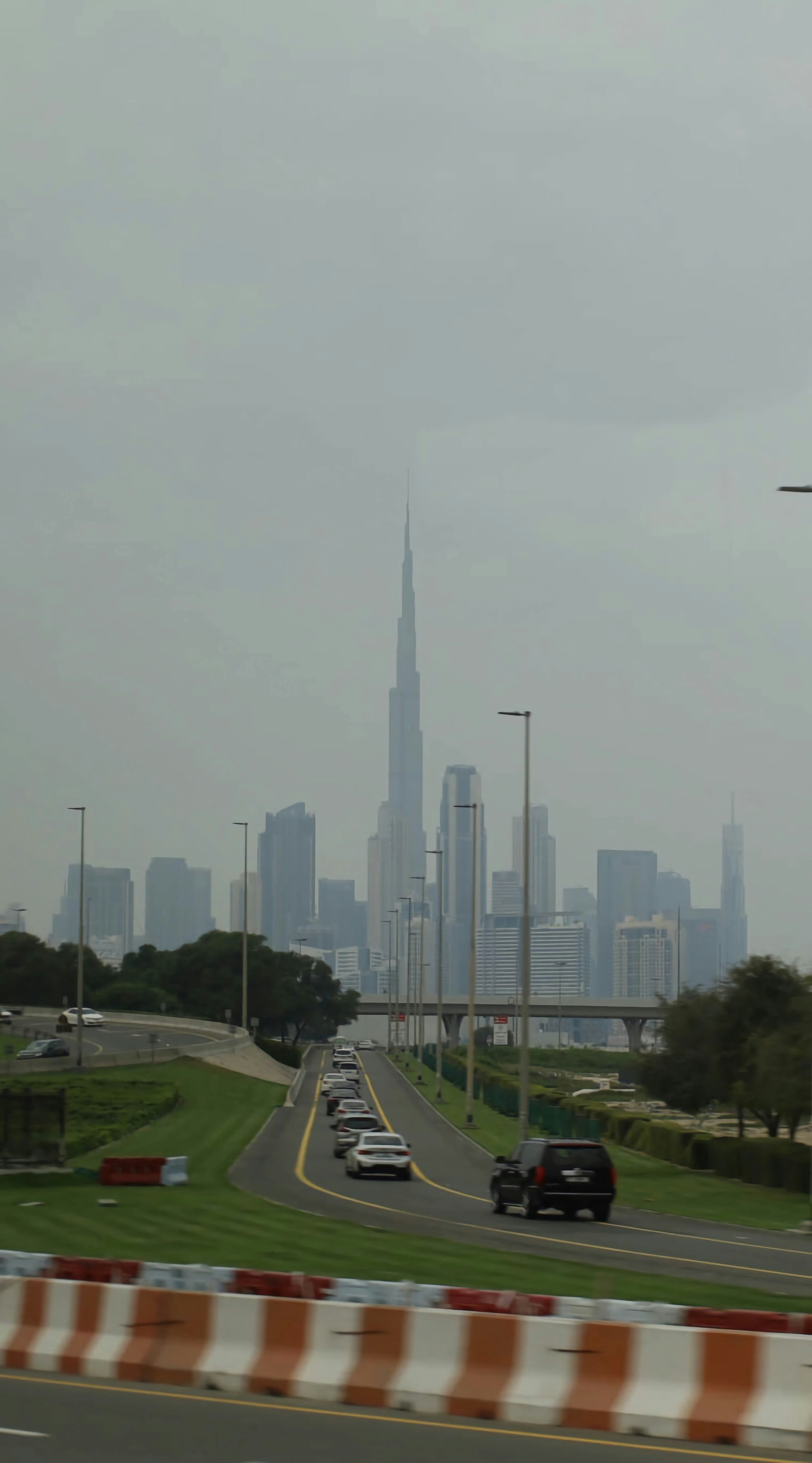 a highway with a city skyline in the background