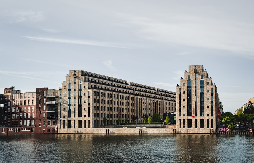 a body of water with buildings in the background