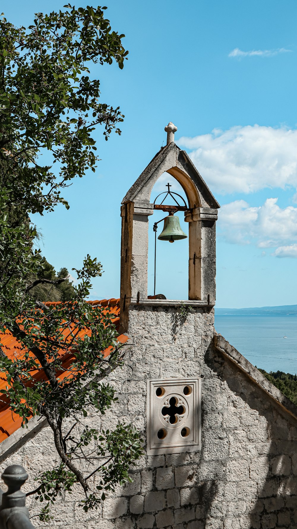 a bell tower with a bell on top of it