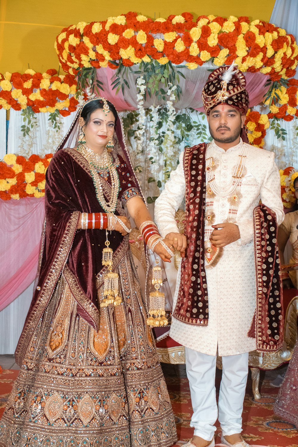 a man and woman dressed in indian attire