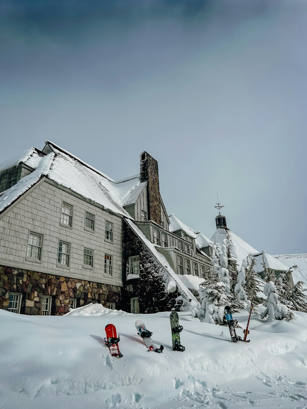 a house with a lot of snow on the ground