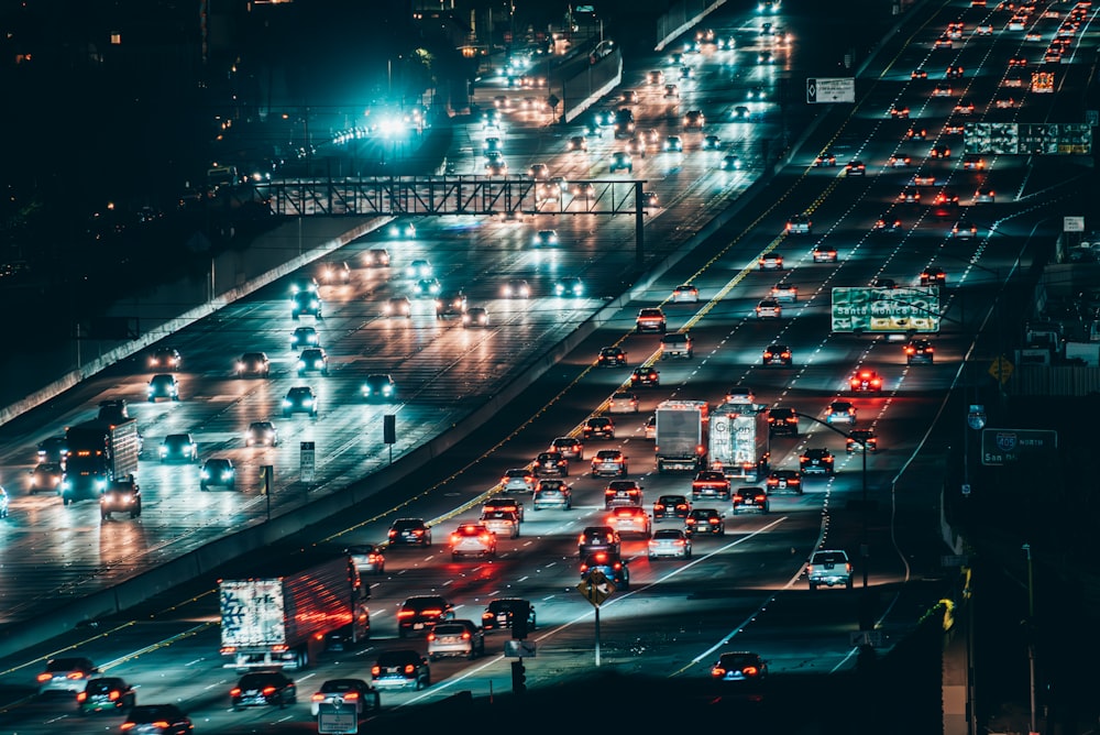 a highway filled with lots of traffic at night