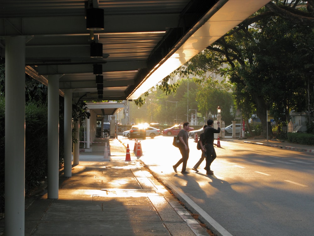 a couple of people walking down a street