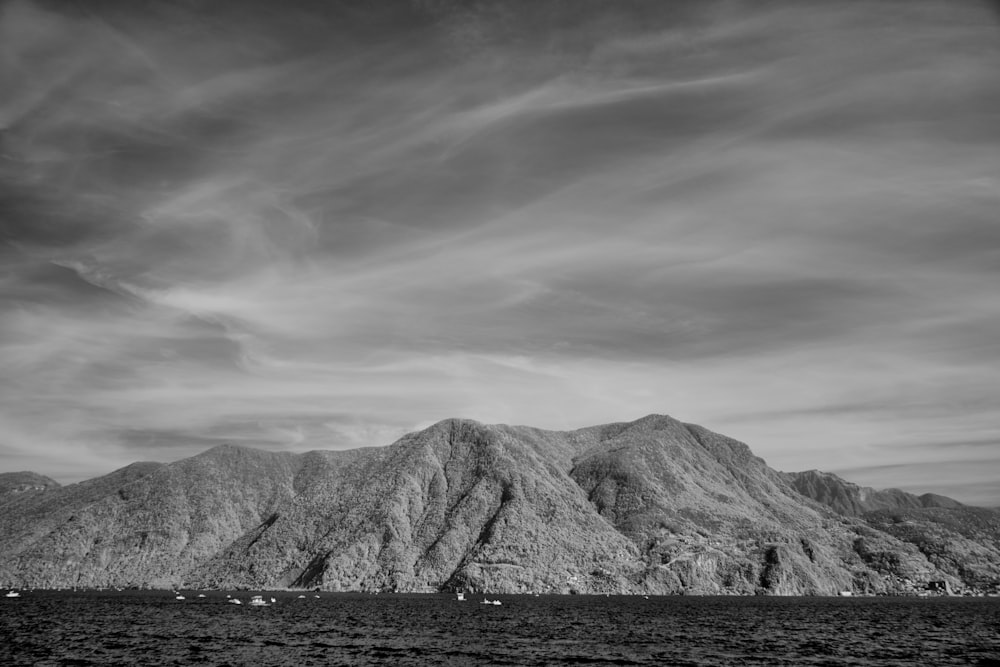 a black and white photo of a mountain range