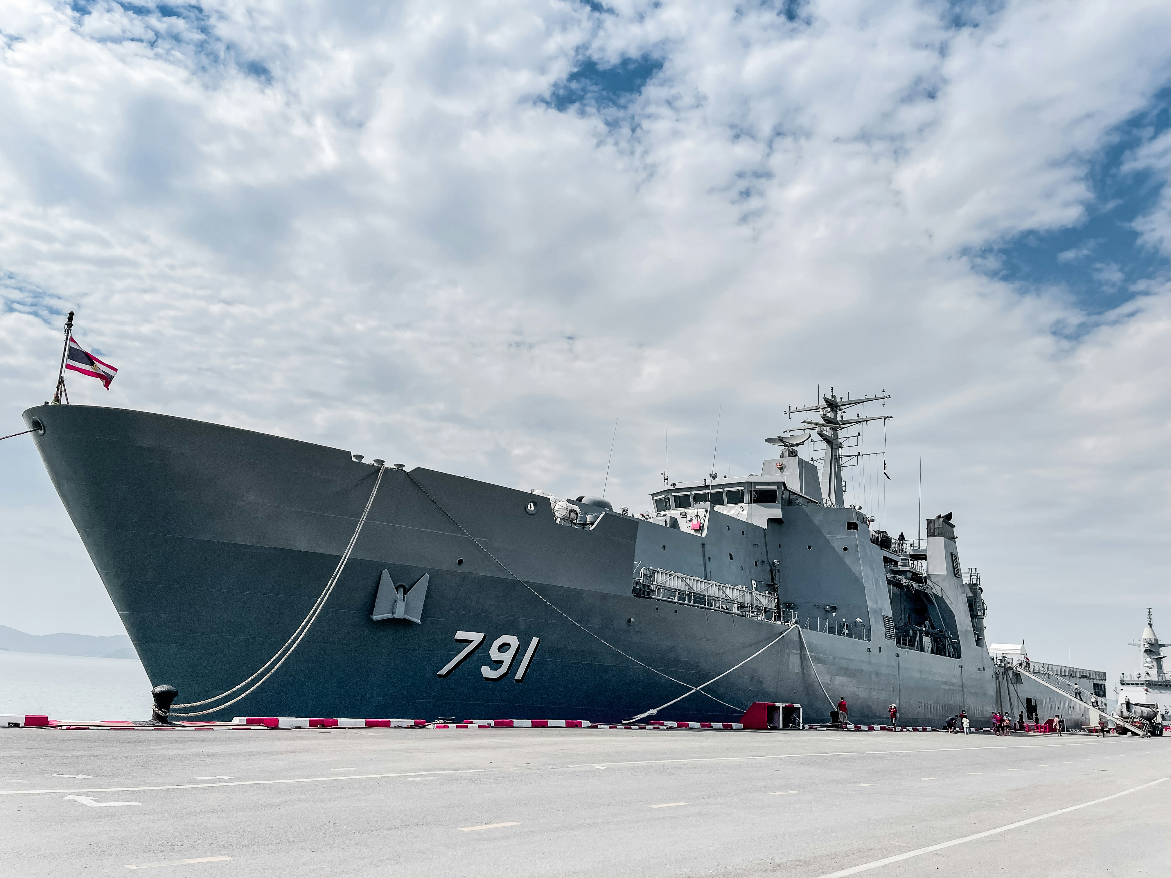 a large battleship sitting on top of a tarmac, 
