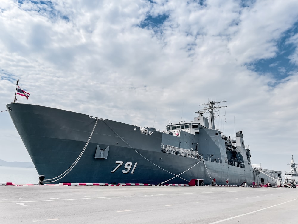 a large battleship sitting on top of a tarmac