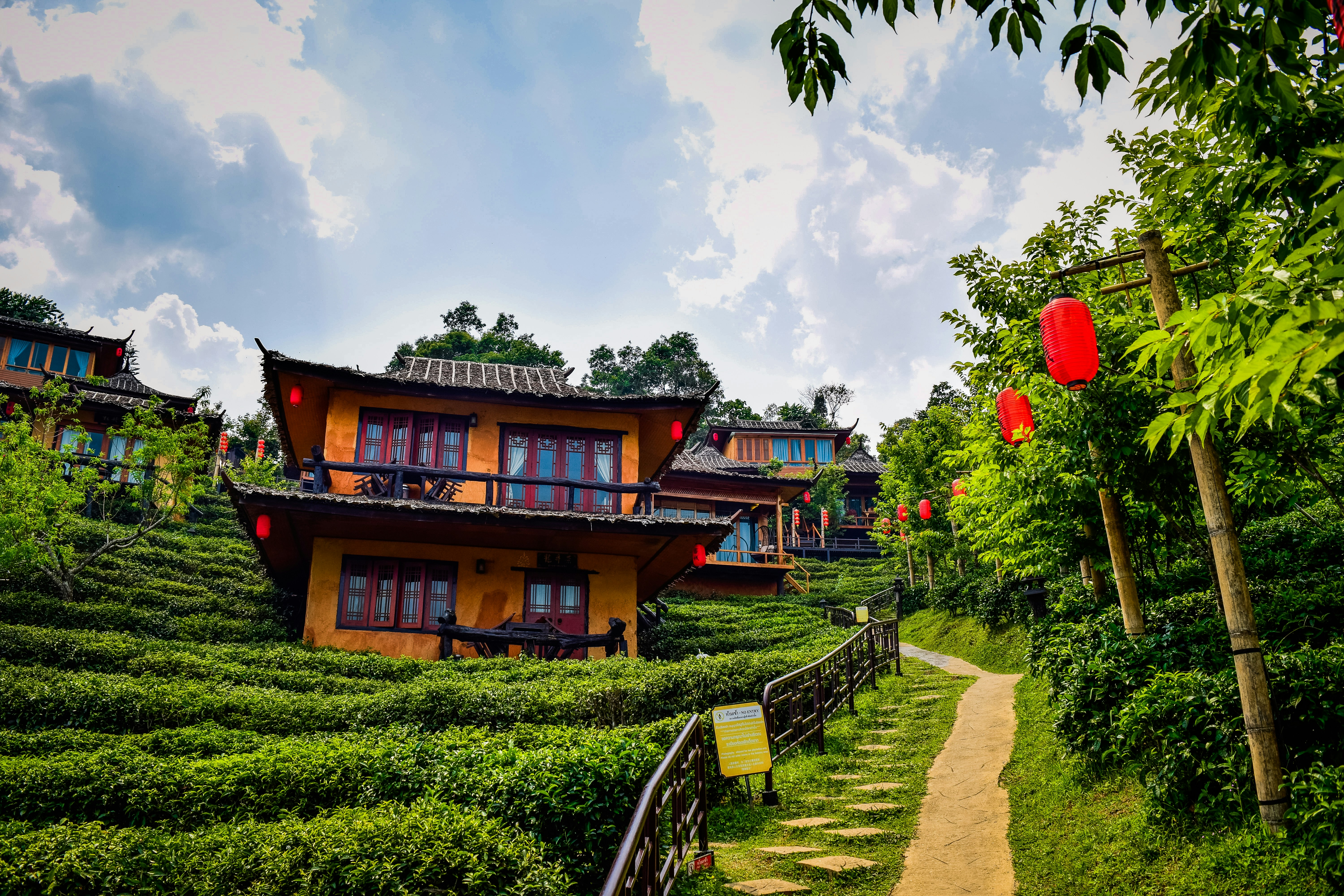 a house on a hill with a path leading to it, 