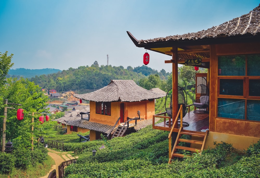 a house with a thatched roof on a hill