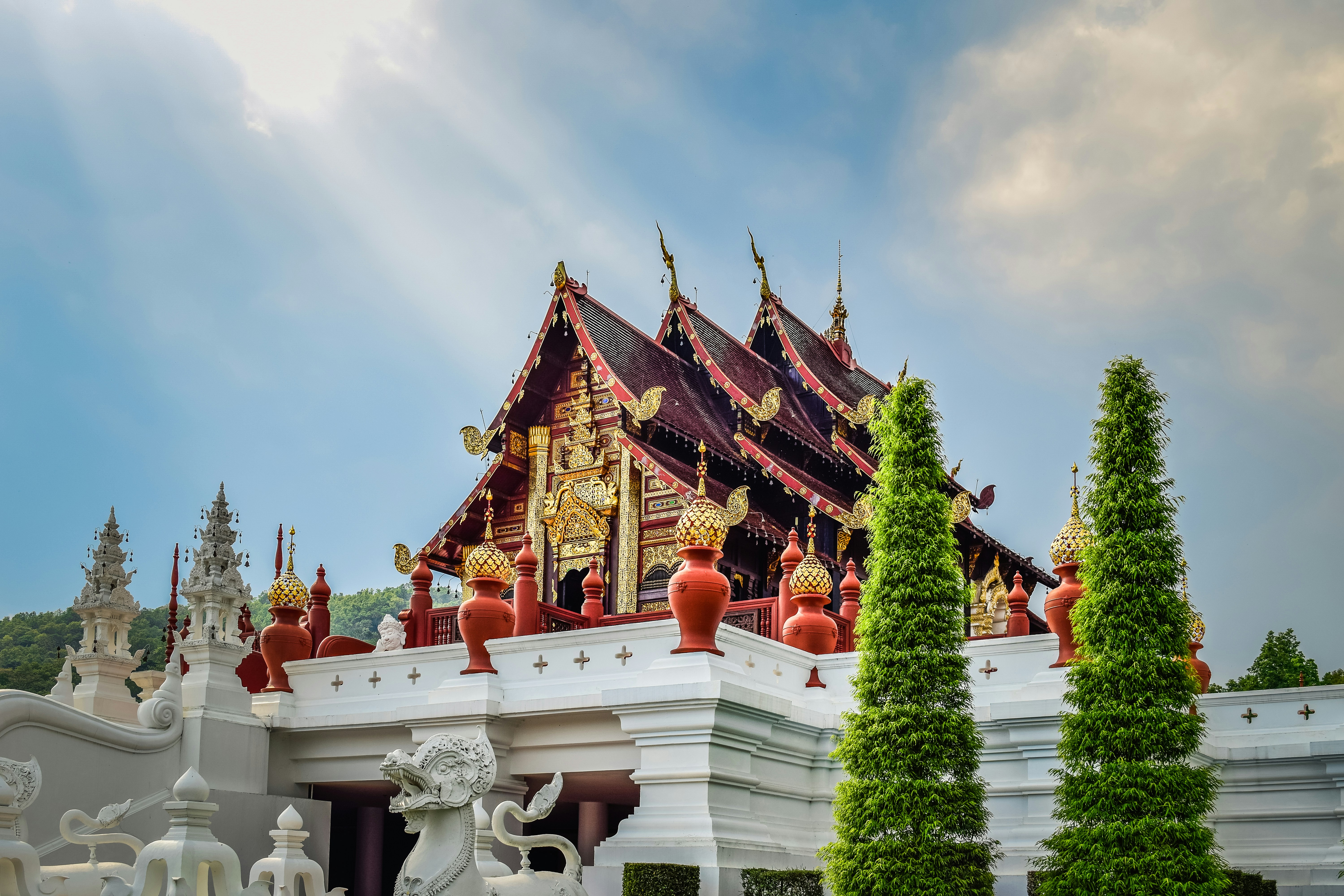 a large white building with a red roof, 