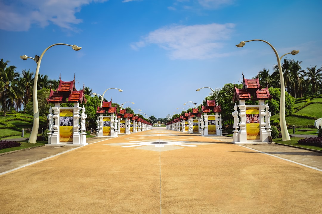 a street lined with lots of white and yellow archways,