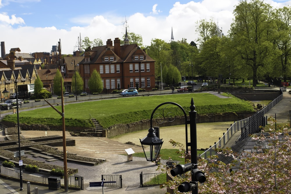 a view of a park with a lot of trees and buildings in the background