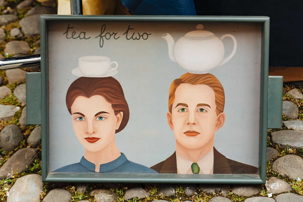 a picture of two people with a tea pot on top of them