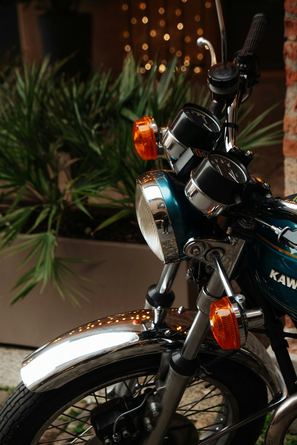 a blue motorcycle parked in front of a building