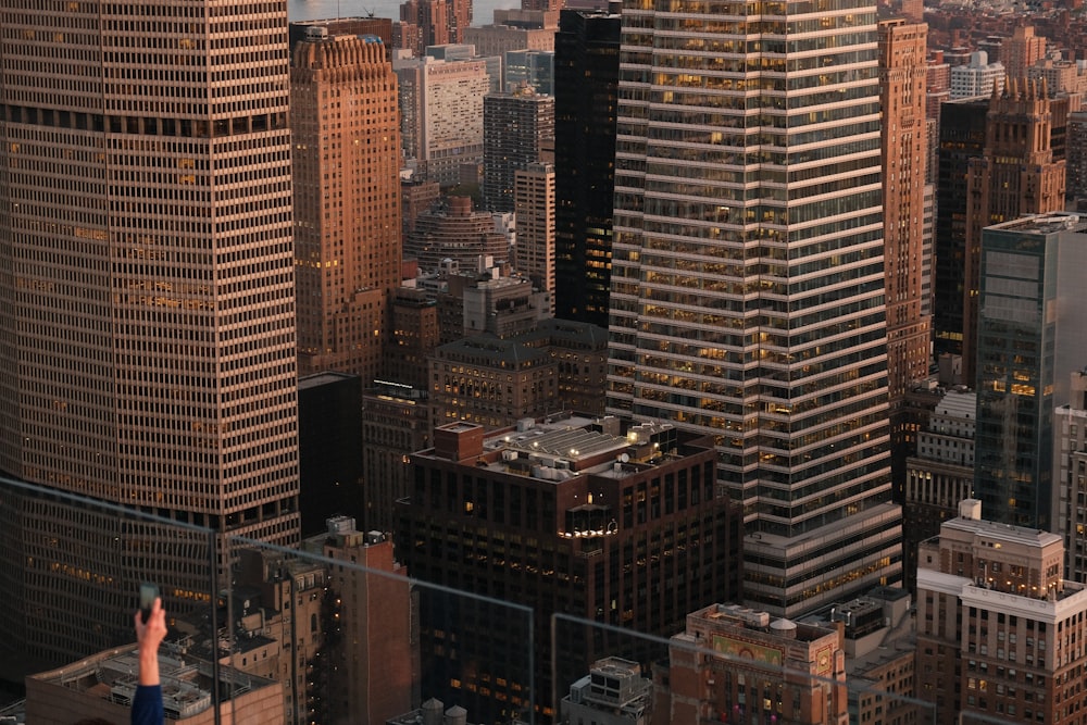 a man standing on top of a tall building