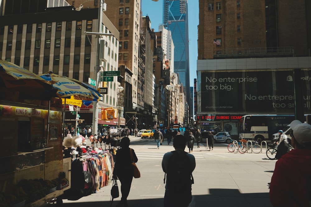 a busy city street with people walking around