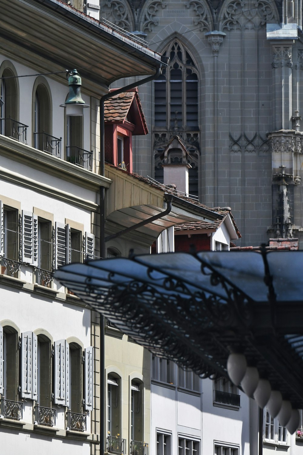 a row of buildings with a clock tower in the background