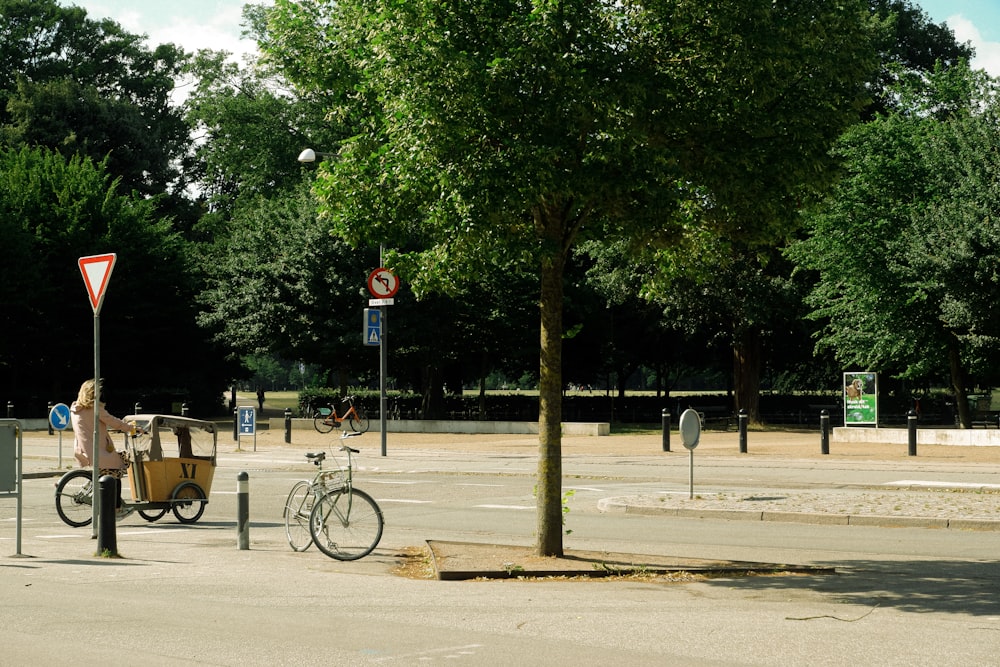 a person riding a bike on a city street