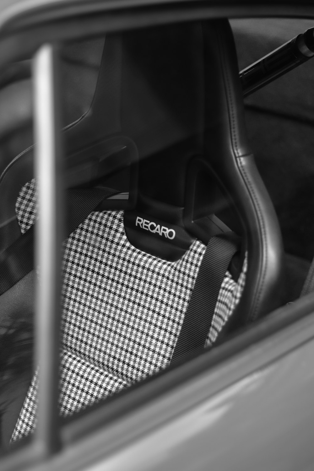 a black and white photo of a car seat
