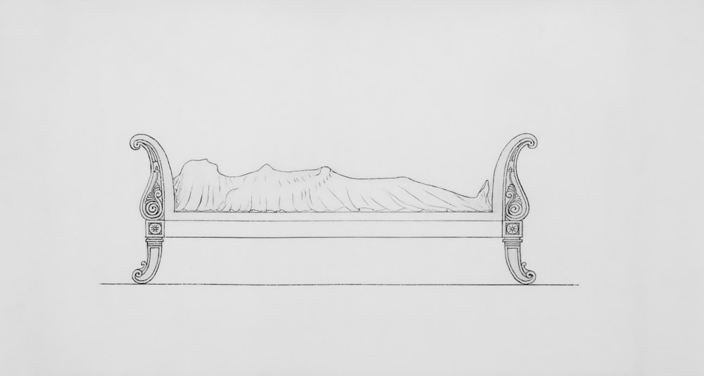 a drawing of a bed with a mountain in the background