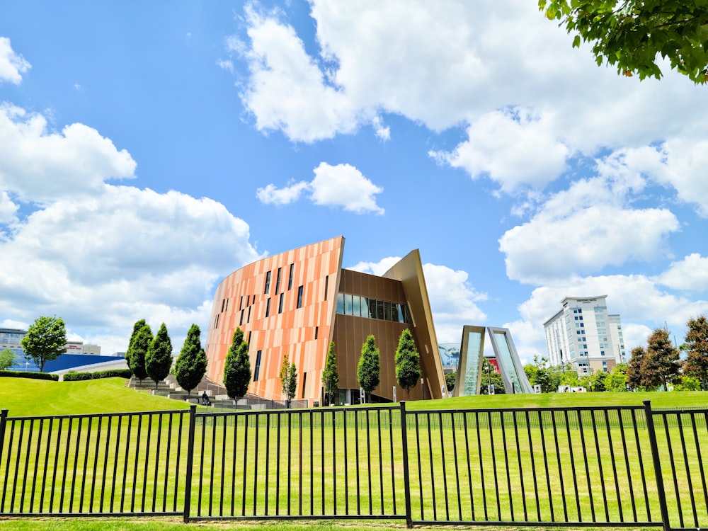 a building with a fence around it on a sunny day