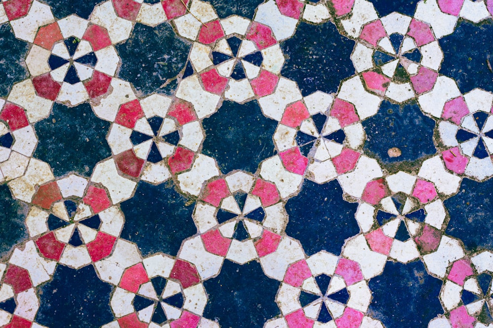 a close up of a colorful tile design