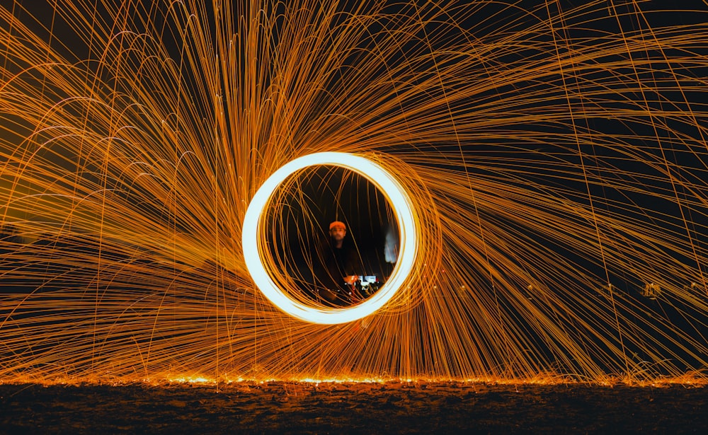 a person standing in a circle of fire