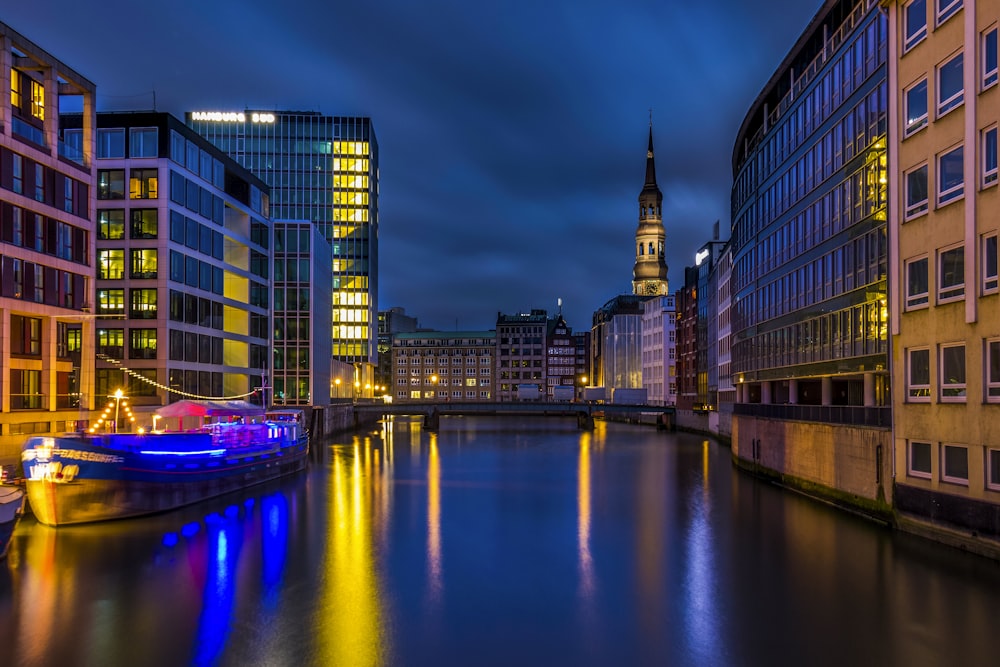 a river running through a city next to tall buildings