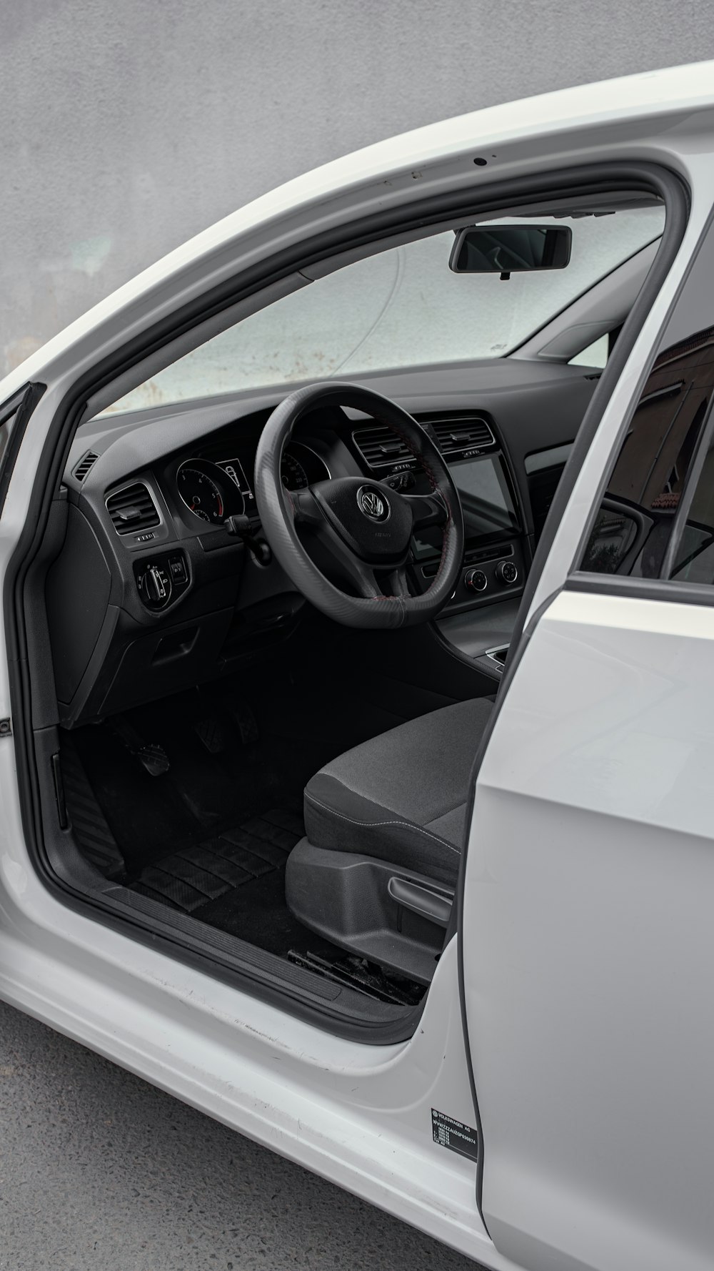 the interior of a car with the door open