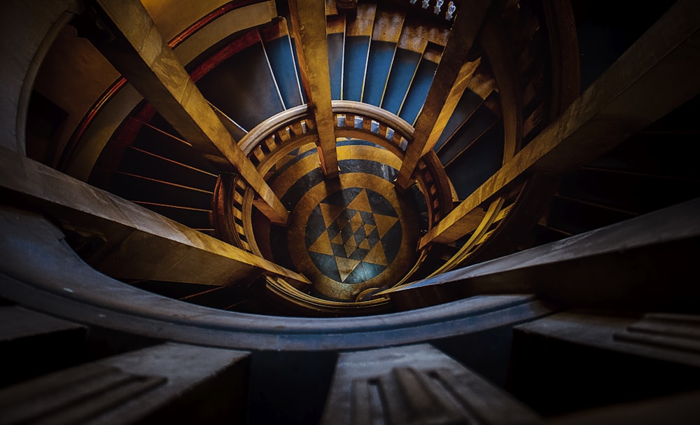 a spiral staircase in a building with a clock on it