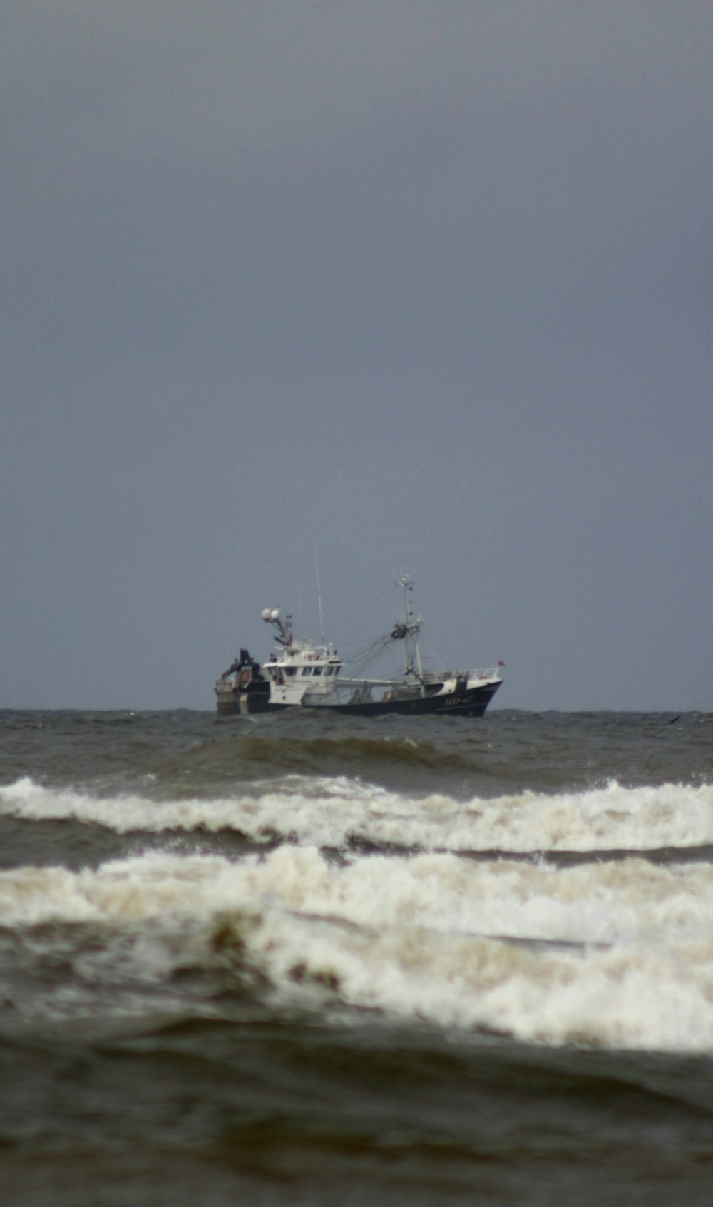 a boat in the middle of a large body of water