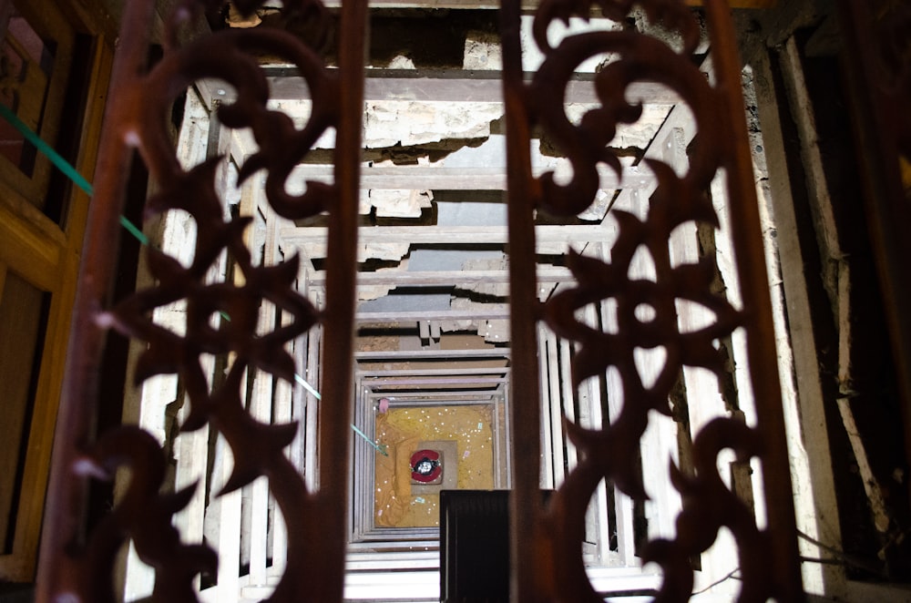 a view of a doorway through a metal gate