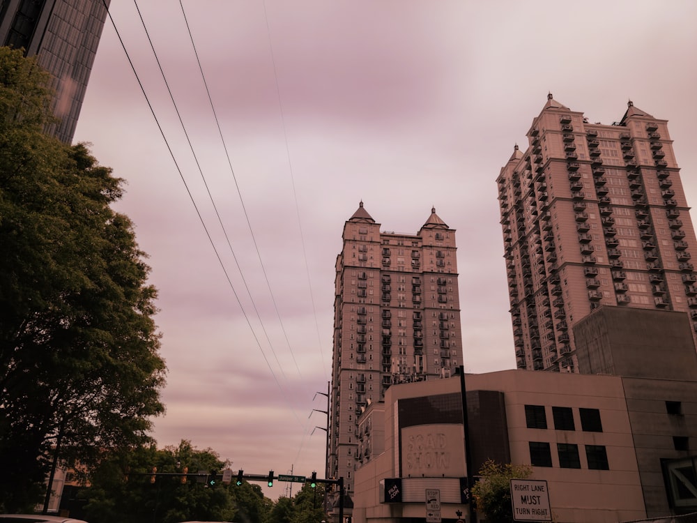 a couple of tall buildings sitting next to each other