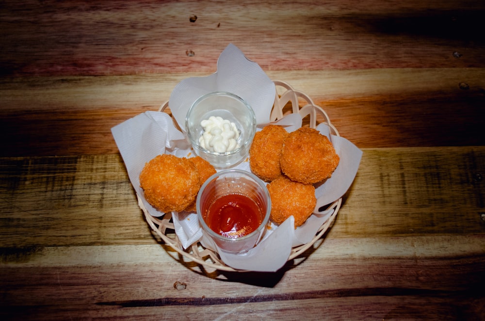 a basket of food on a wooden table