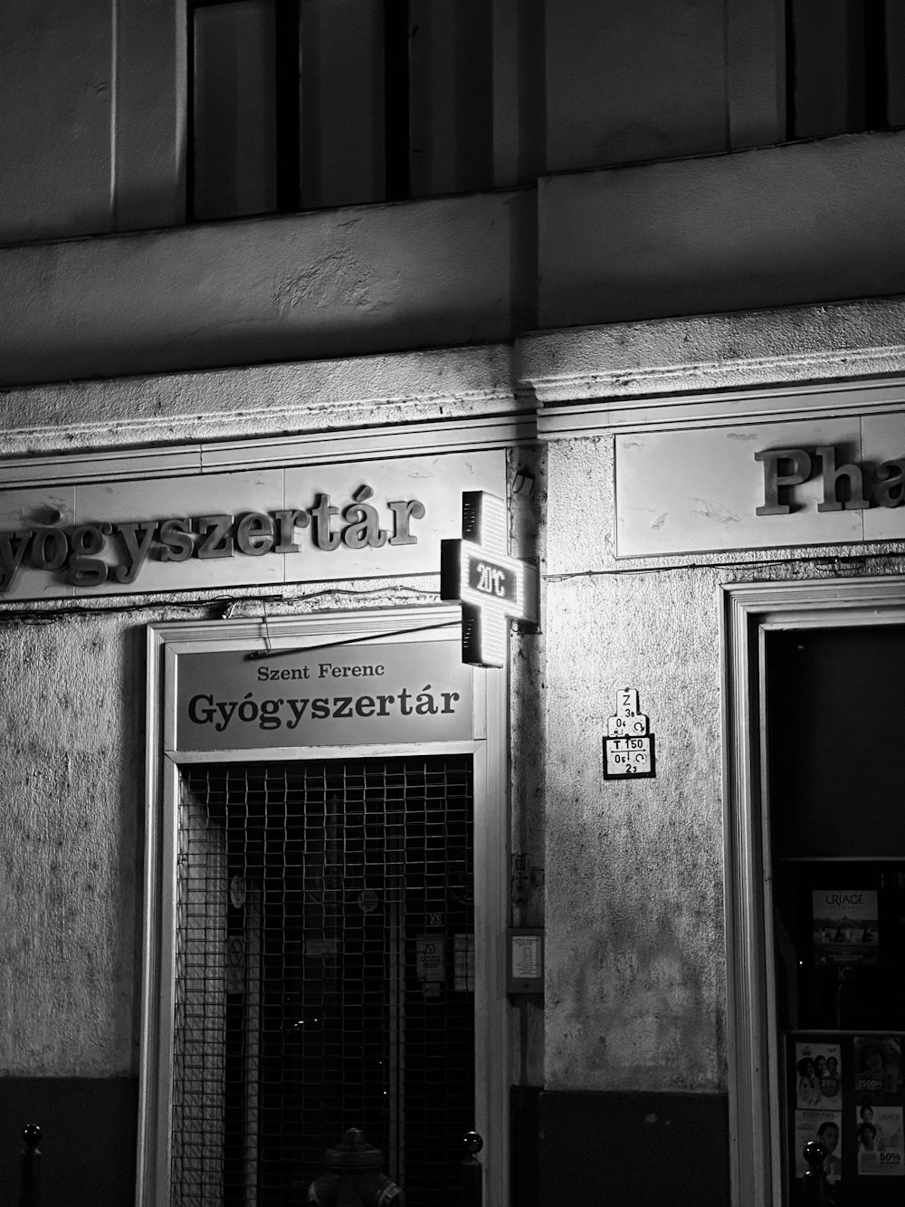 a black and white photo of a store front